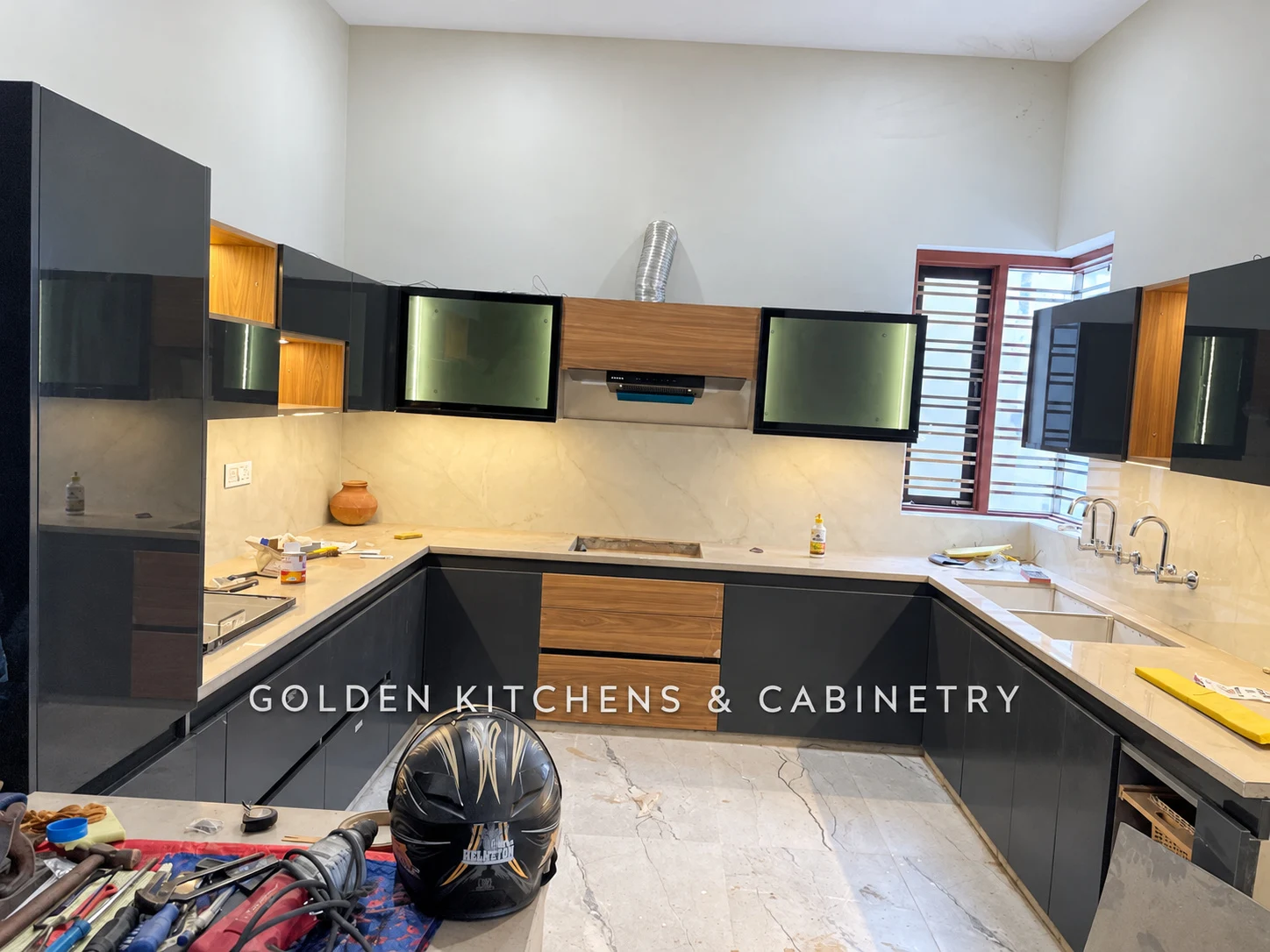 Dark kitchen with wood accents during installation