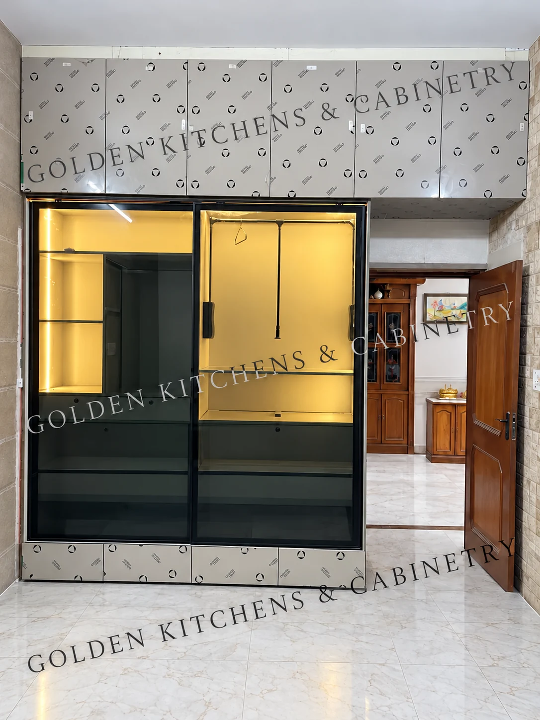 Illuminated glass wardrobe during installation