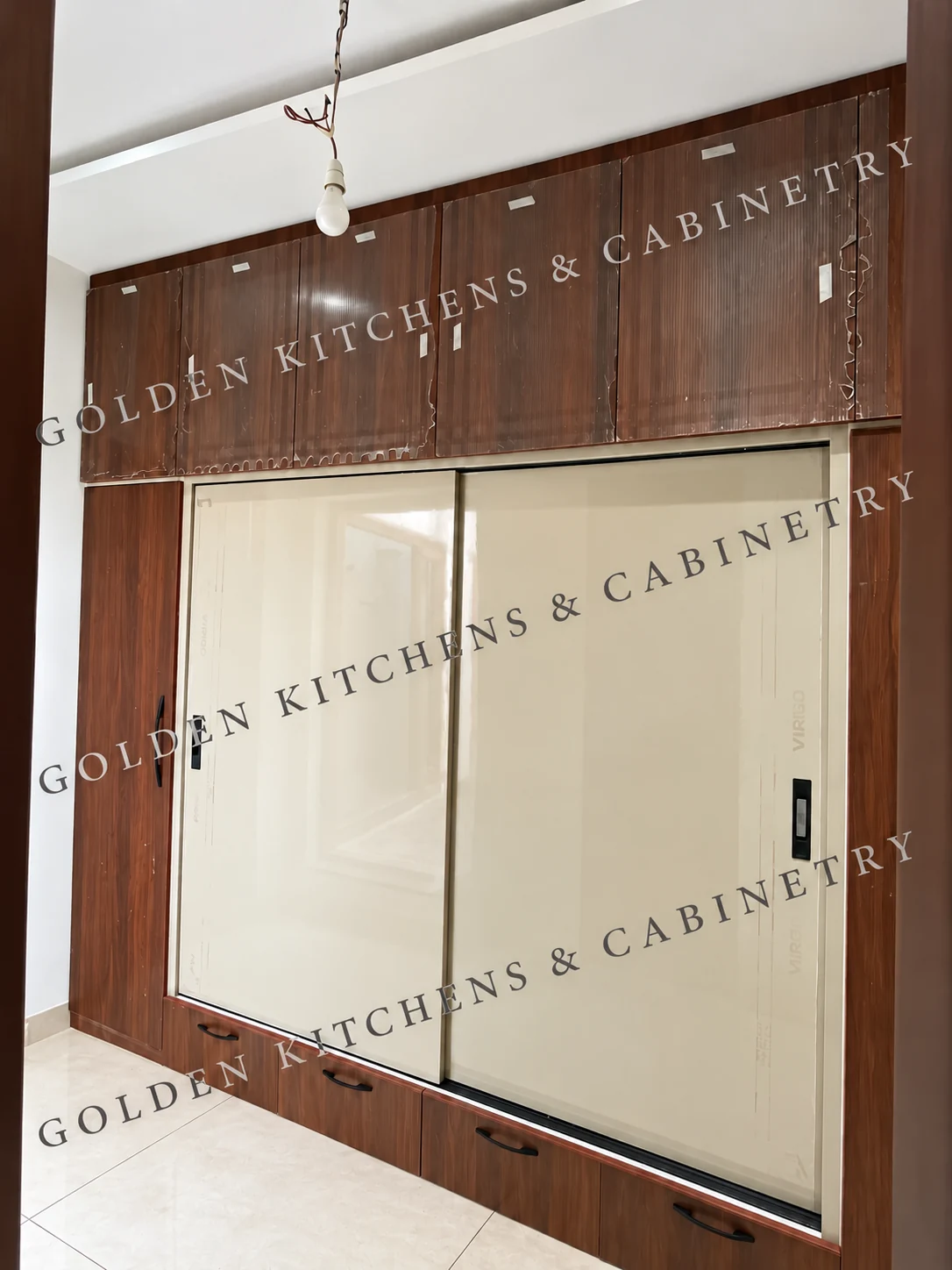 Cream sliding wardrobe with a woodgrain surround
